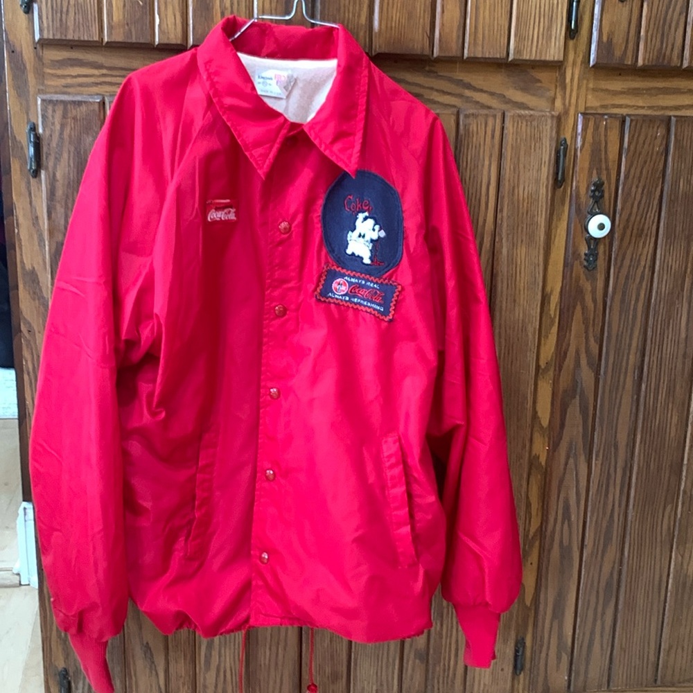 Coca Cola  Red windbreaker Jacket 
Size  XL
Also called King Louie